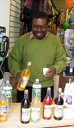 Oliver Samuels promoting Pure Bulk Syrup at Sam's Caribbean.  Jamaican syrup.  Jamaican food.  Caribbean food, jamaican drink.