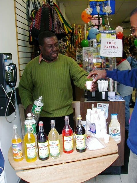 Oliver Samuels promoting Pure Bulk Syrup at Sam's Caribbean.  Jamaican syrup.  Jamaican food.  Caribbean food, jamaican drink.