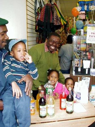 Oliver Samuels promoting Pure Bulk Syrup at Sam's Caribbean.  Jamaican syrup.  Jamaican food.  Caribbean food, jamaican drink.